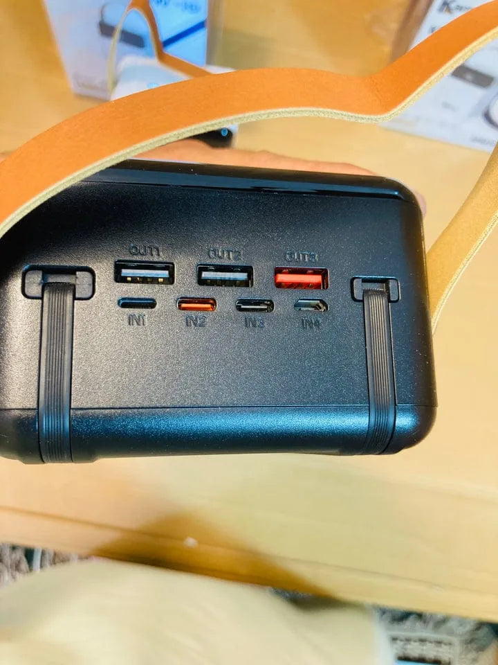 Black electronic device with multiple ports on a blurred background